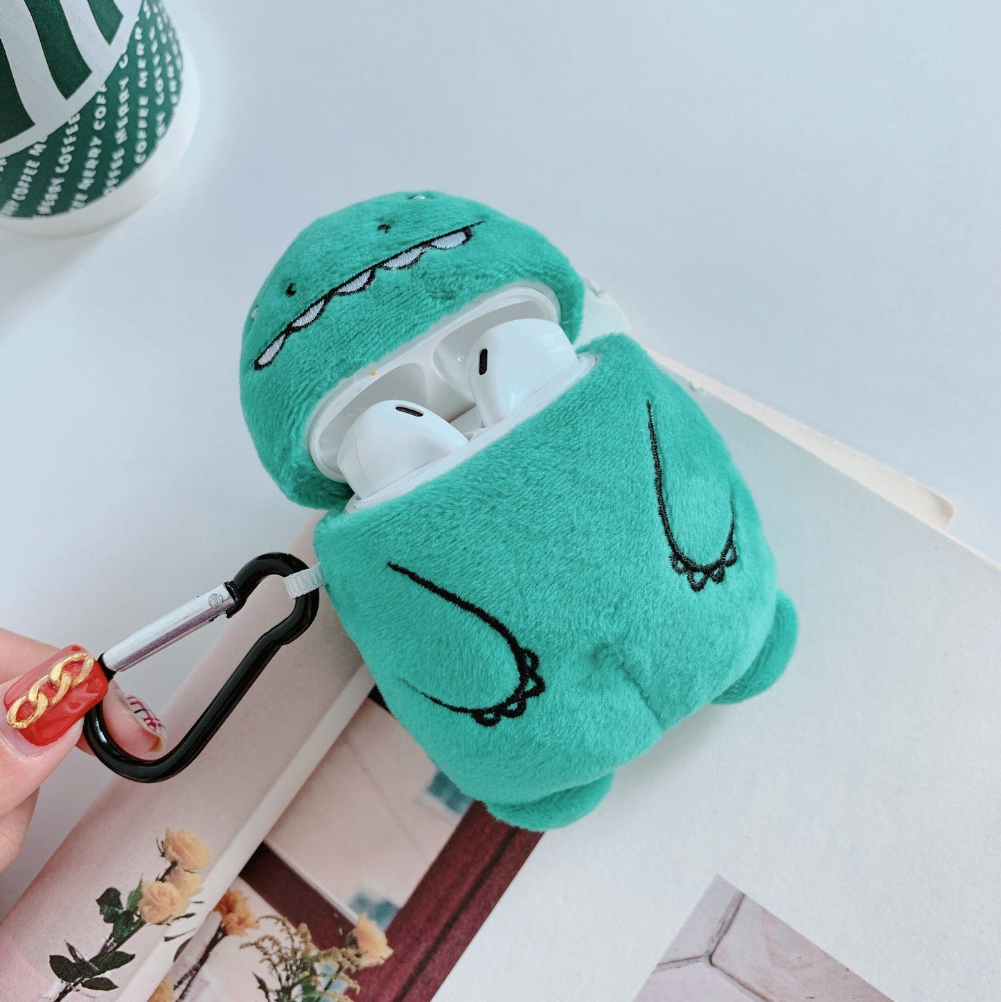 Plush dinosaur bluetooth headset case